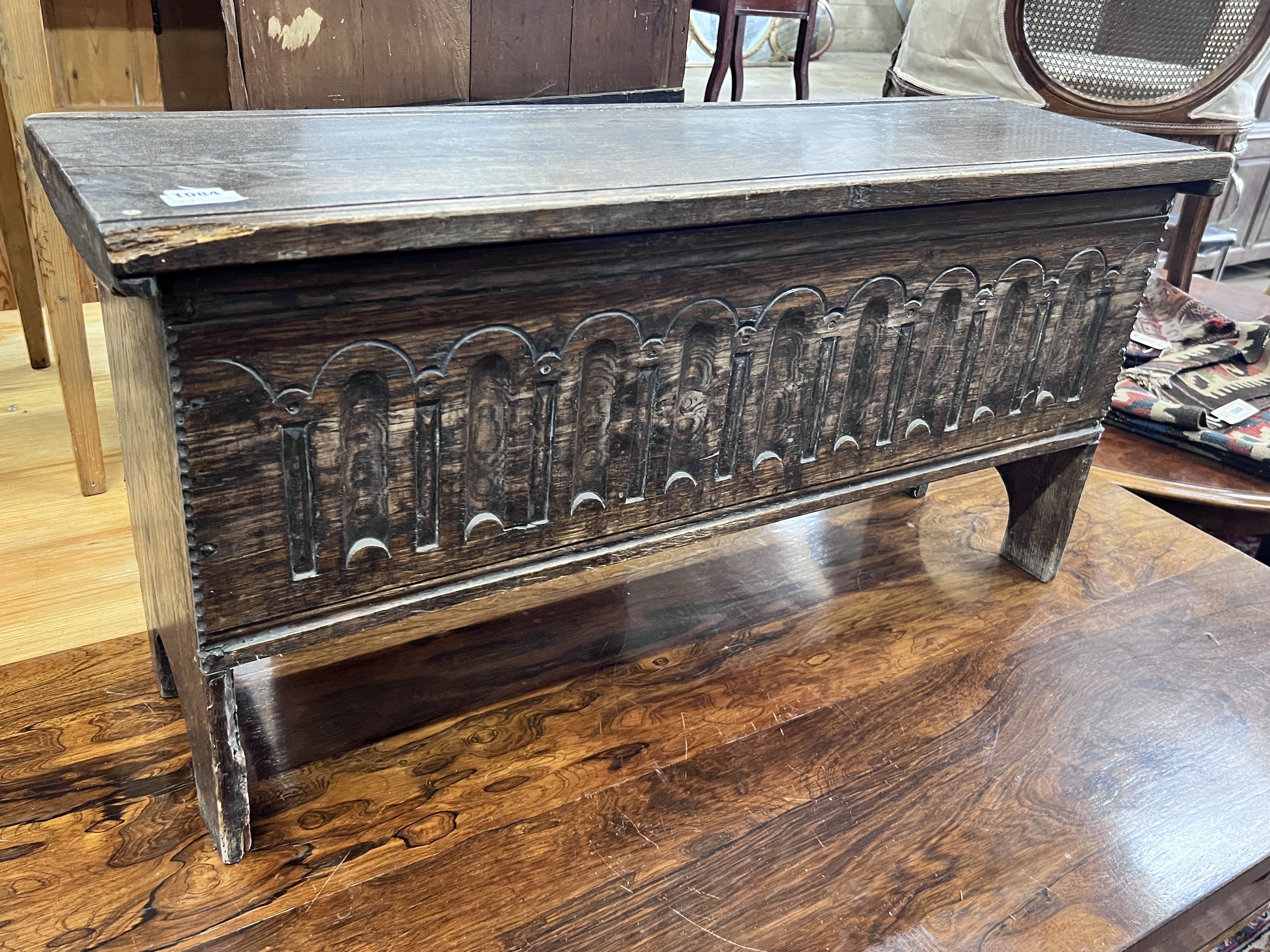 A 17th century style linenfold oak coffer, length 97cm, width 30cm, height 49cm